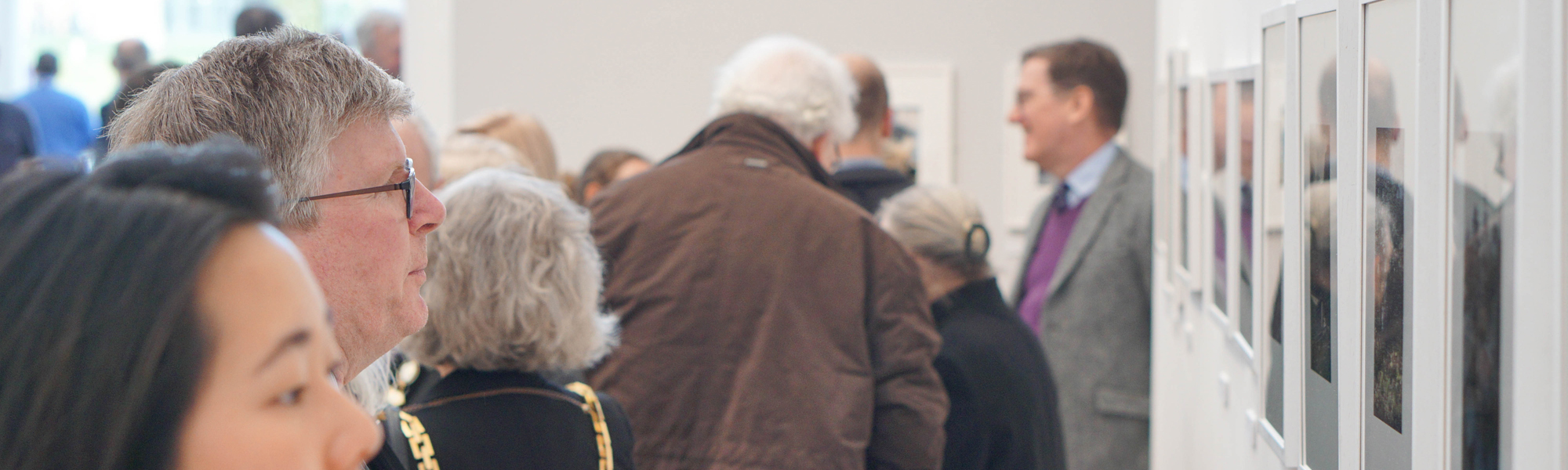 Visitors looking at art in an exhibition