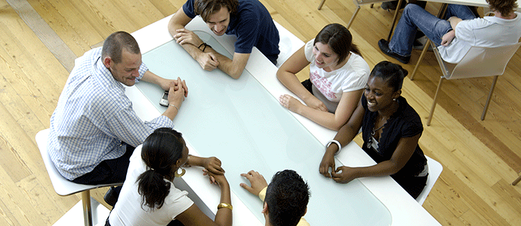 Students around a table from above