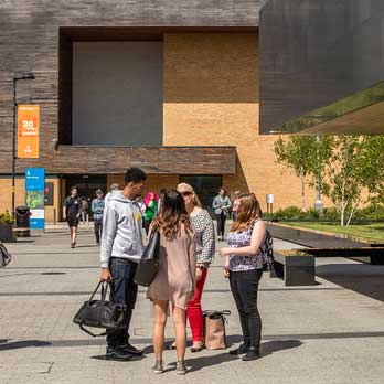 Students taking outside reception