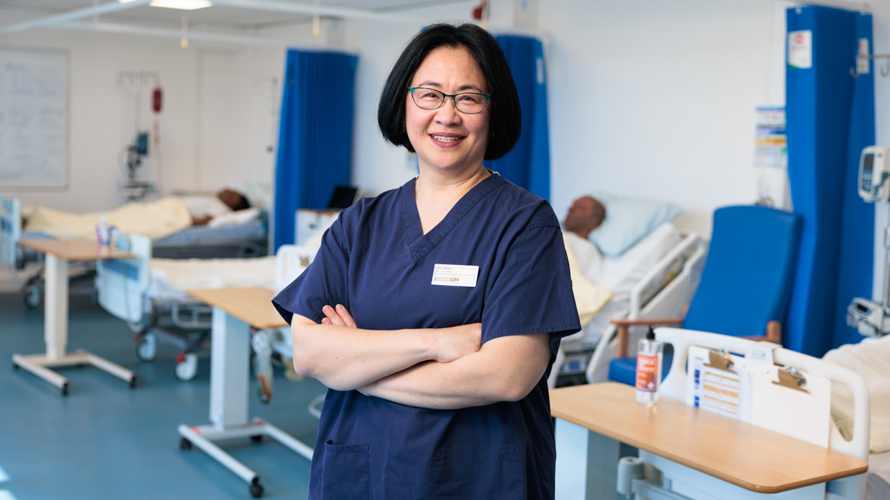a good example of a member of the herts community looking straight at the camera in a well lit university location