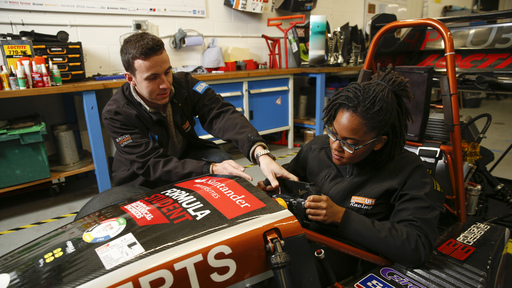 Female student in race car