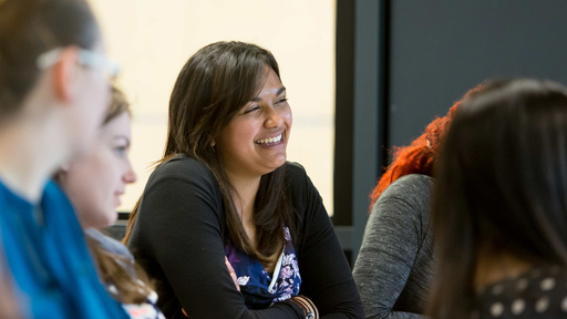 Student smiling in class room