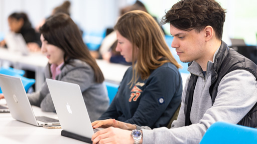 Students working at laptops