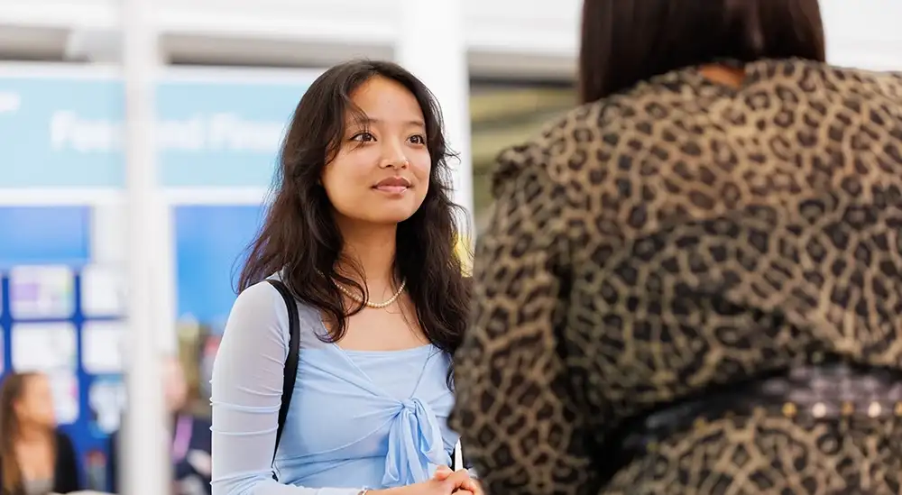 A potential student talking to lecturer