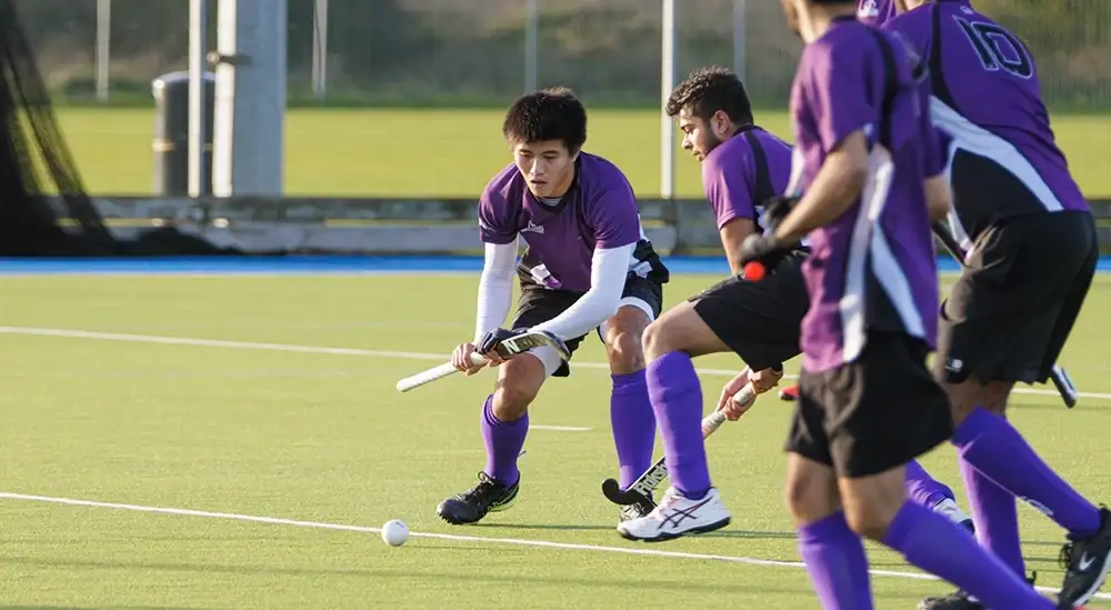 People playing Hockey