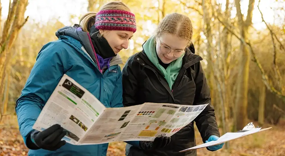 Students looking at an info sheet