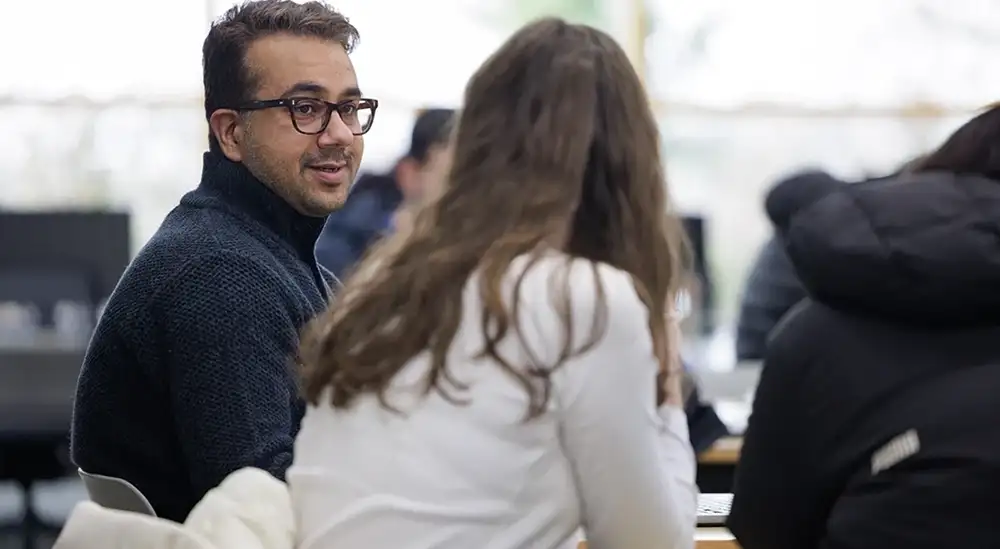 A lecturer talking to a student