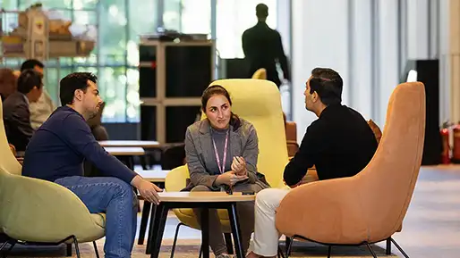 People sitting round a table talking