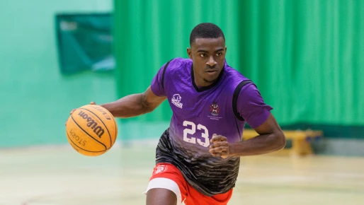 Student playing basketball 