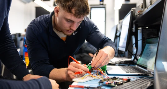 Student working on motherboard