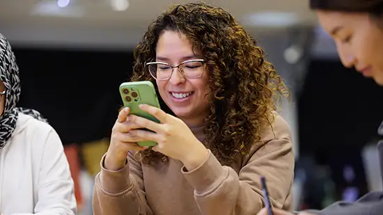 Student looking at phone