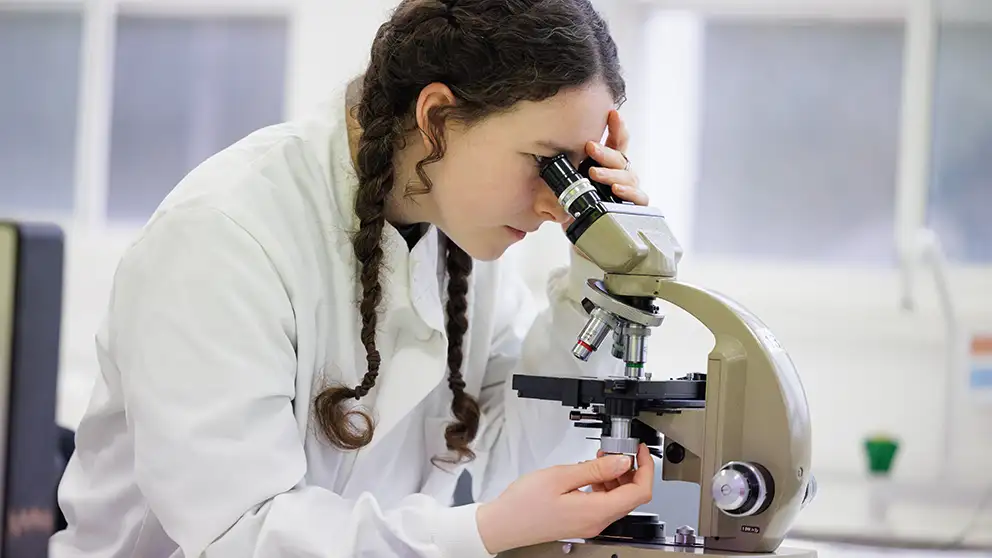 Student in lab header