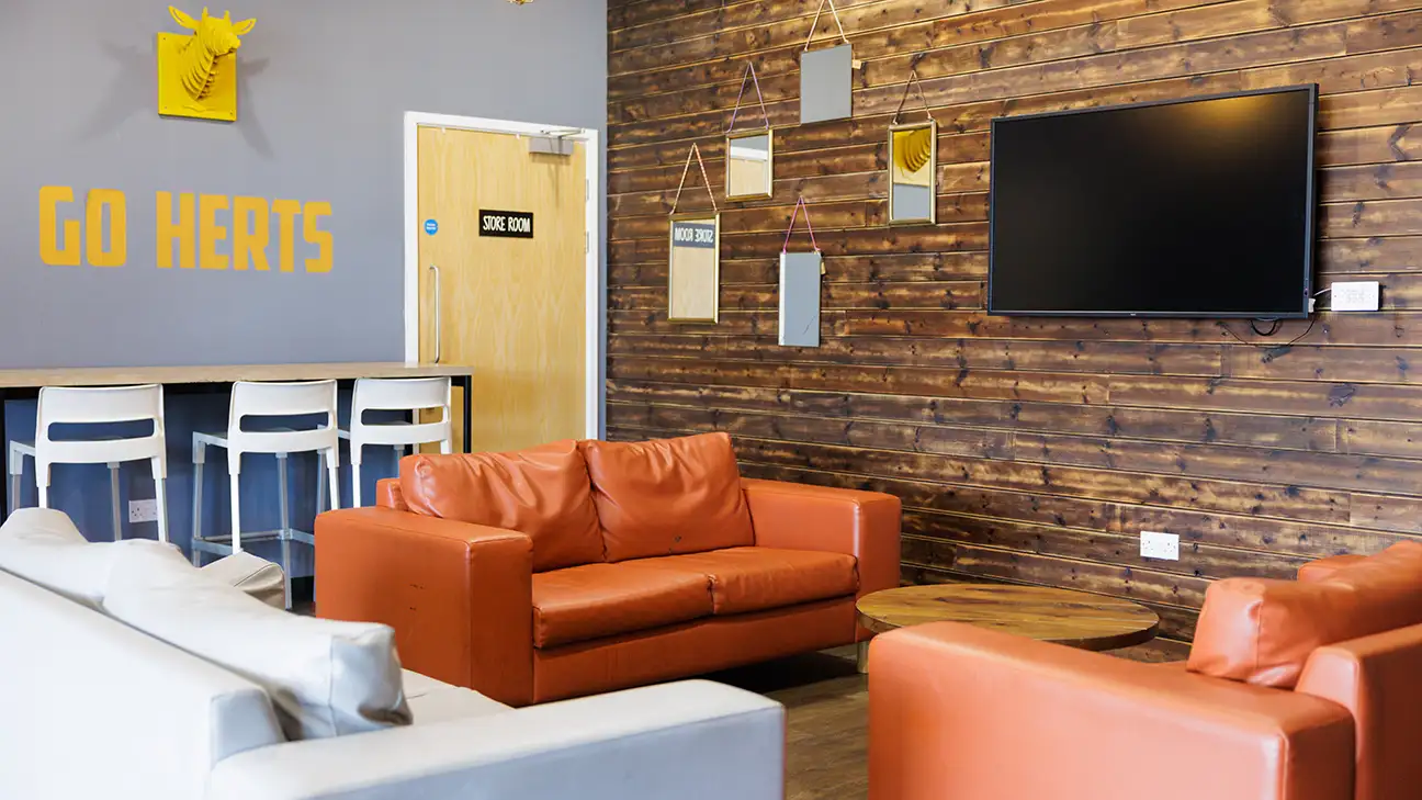 Orange sofas in room