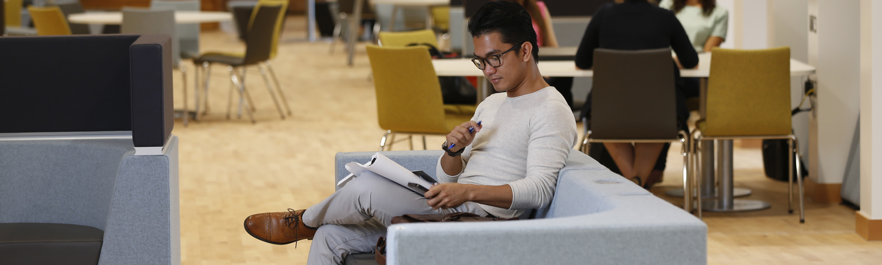 Student studying on sofa