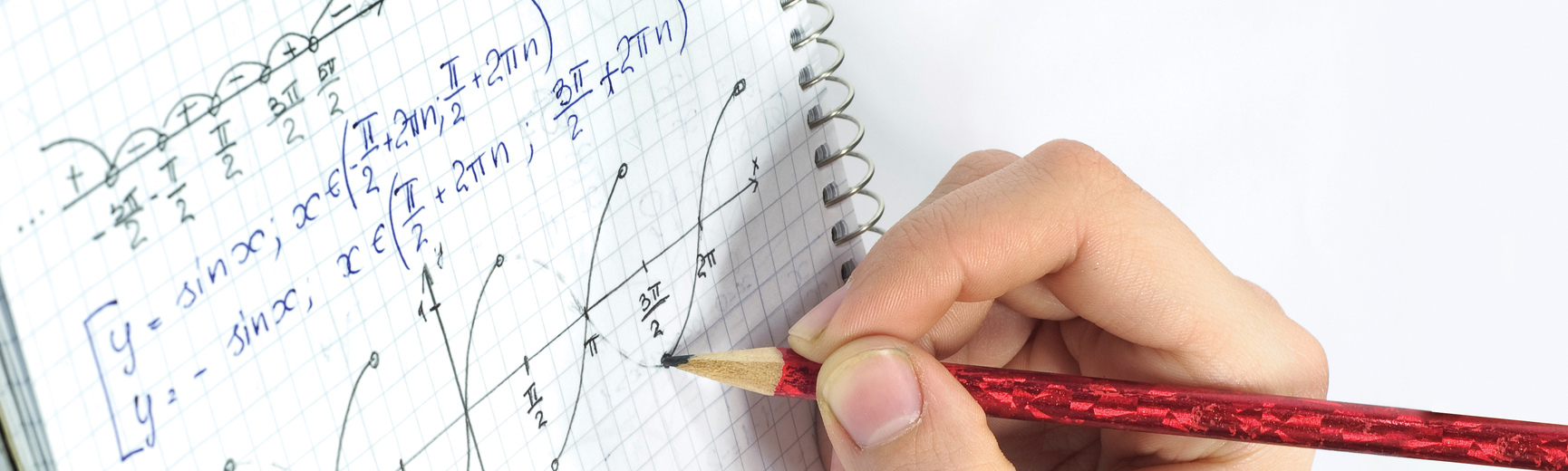 Student writing mathematics equation on notebook with pencil