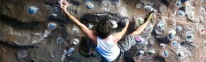 a climber uses the climbing wall at Herts