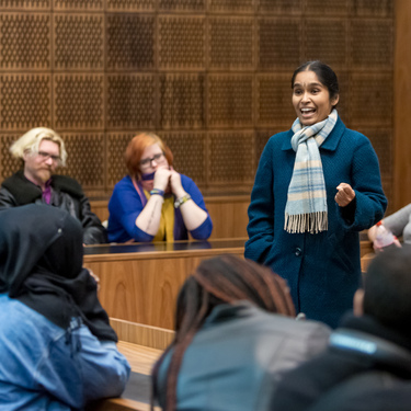 law lecturer presents an argument in a mock law court