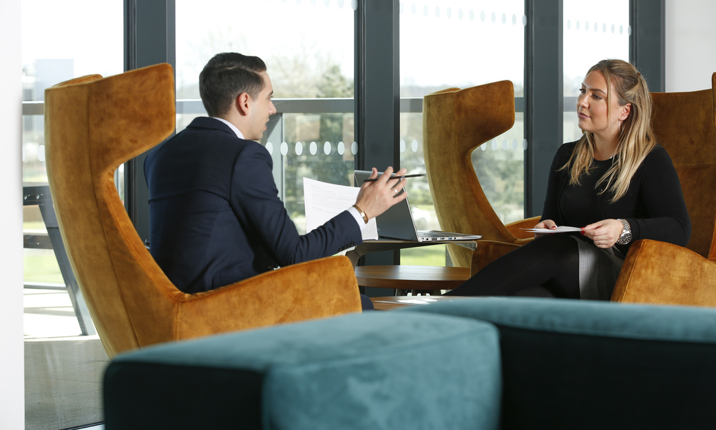 two students meeting to discuss a project, formally dressed