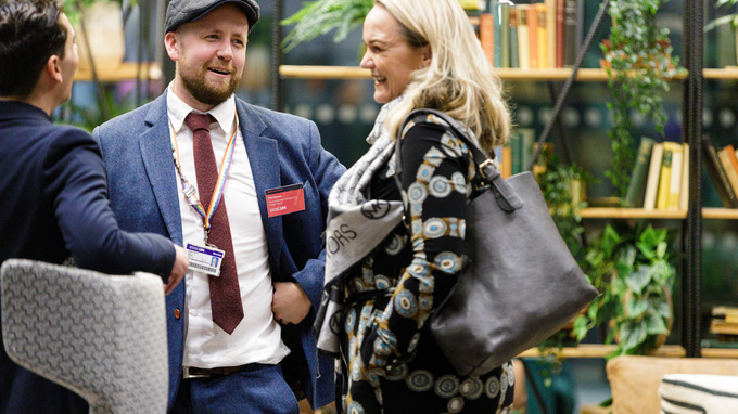 People chatting at an event in the Enterprise Hub