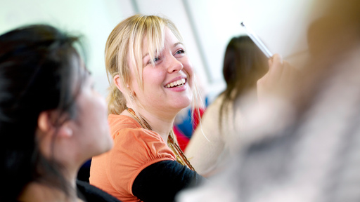 Female student smiling during lecture
