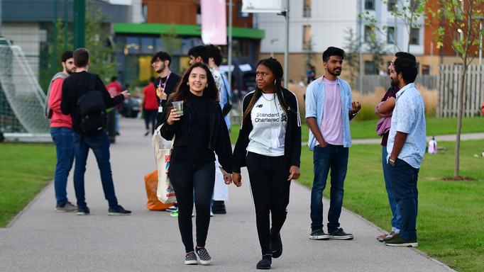 Image of a group of students walking on university campus