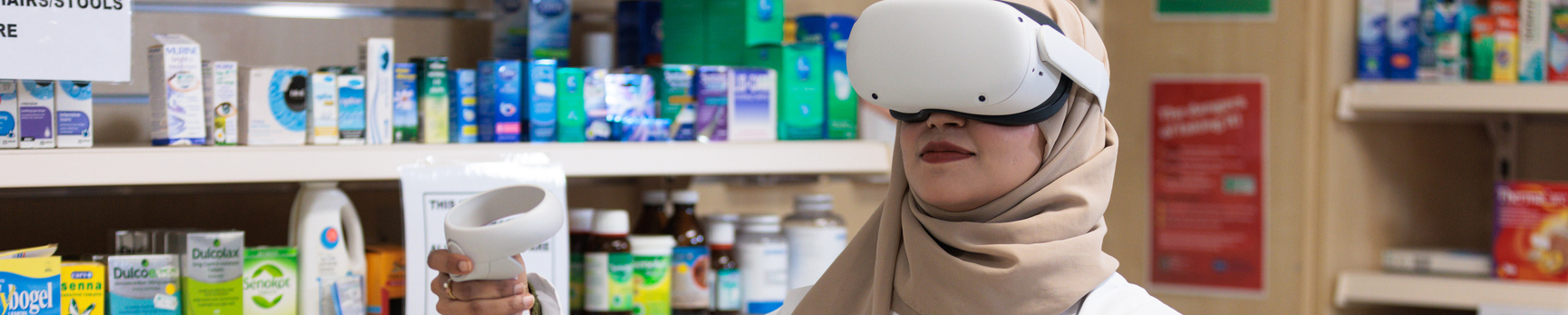 Female student wearing virtual reality headset
