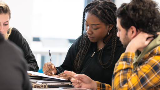 Close up of two students working together