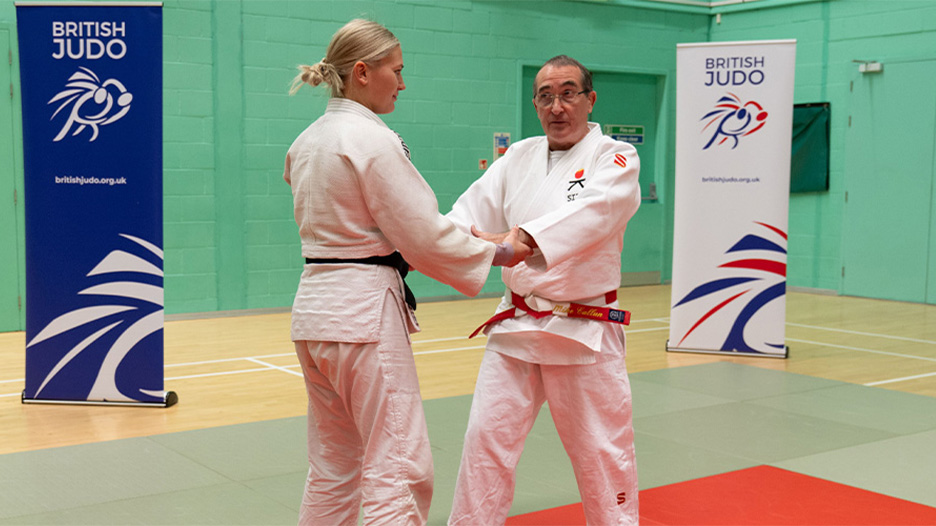 A man and a woman practicing Judo
