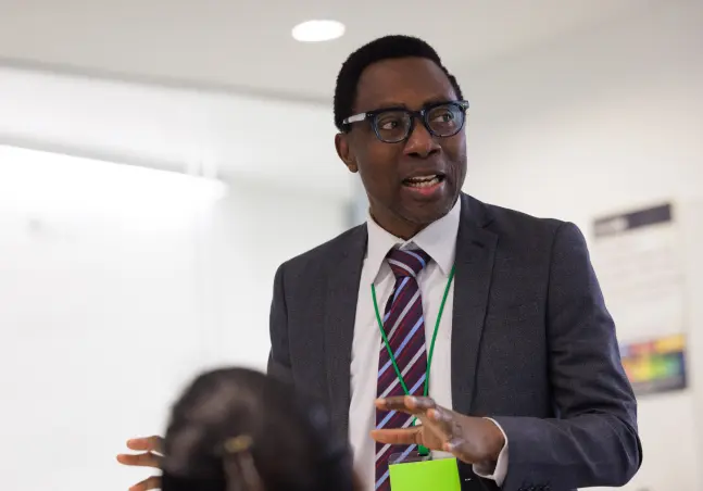 Lecturer talking to students