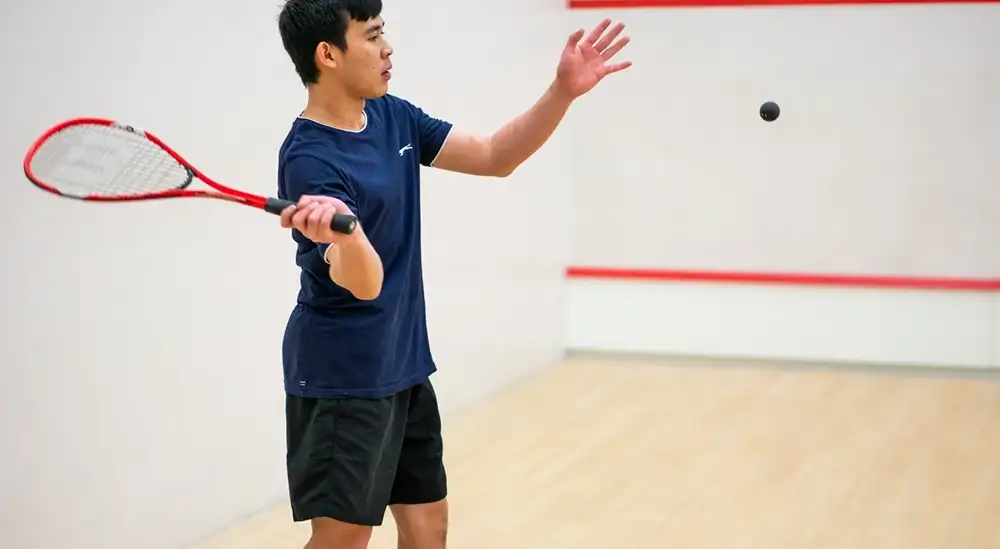 Two people playing Squash 
