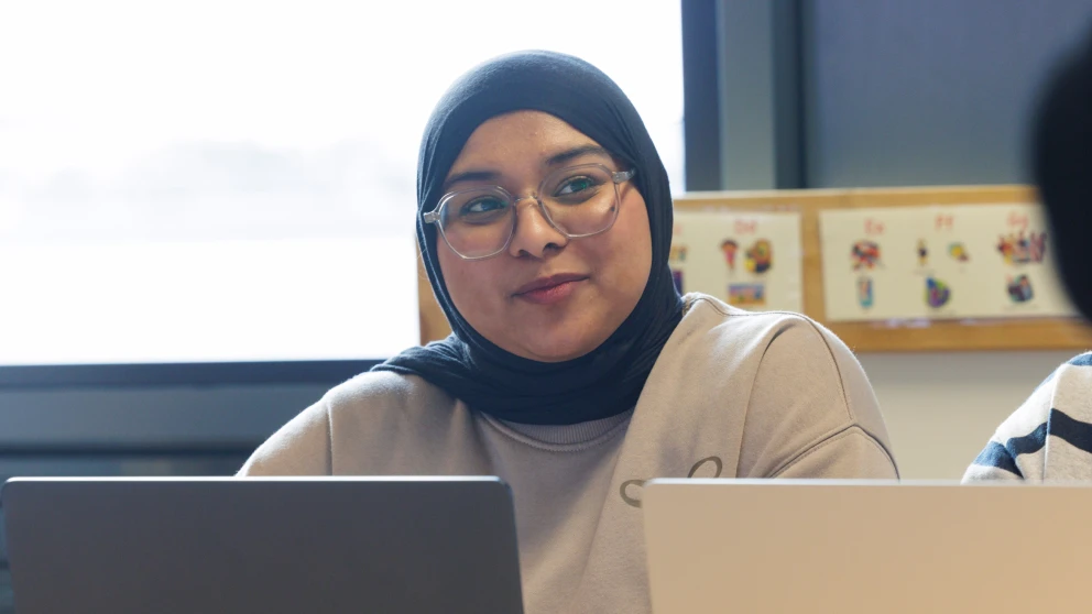 Student in a headscarf smiling