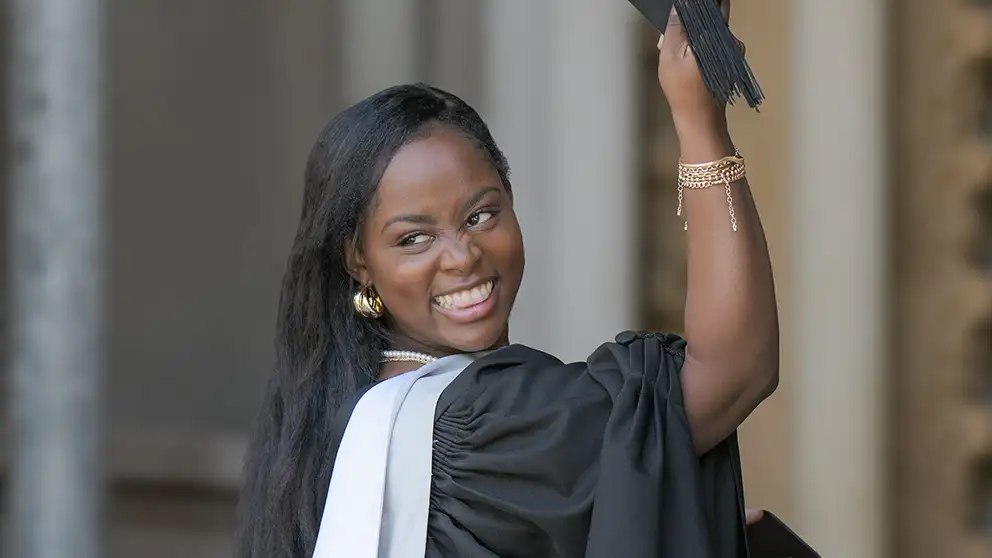 Student taking photo at graduation 
