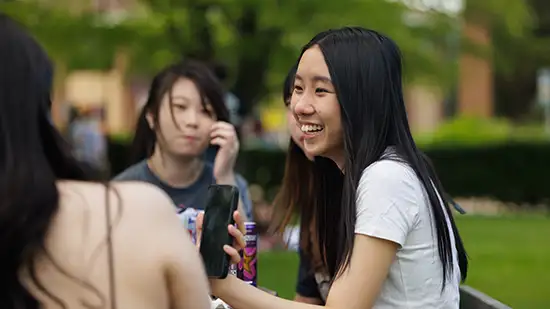 Students sitting outside 