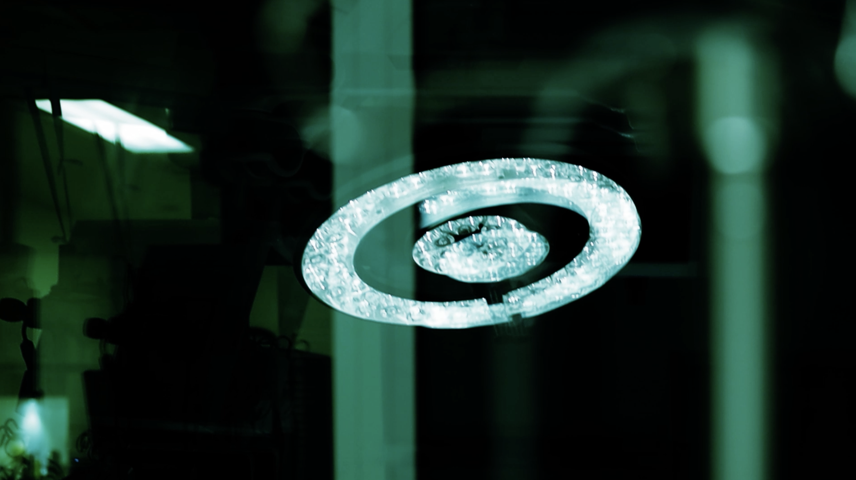 A circle of lights behind glass