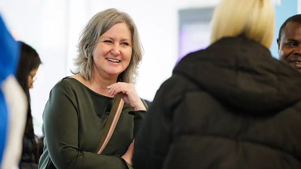 A parent talking to a staff member