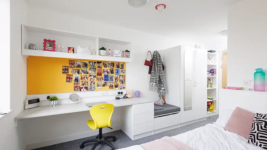 Room with desk and bed