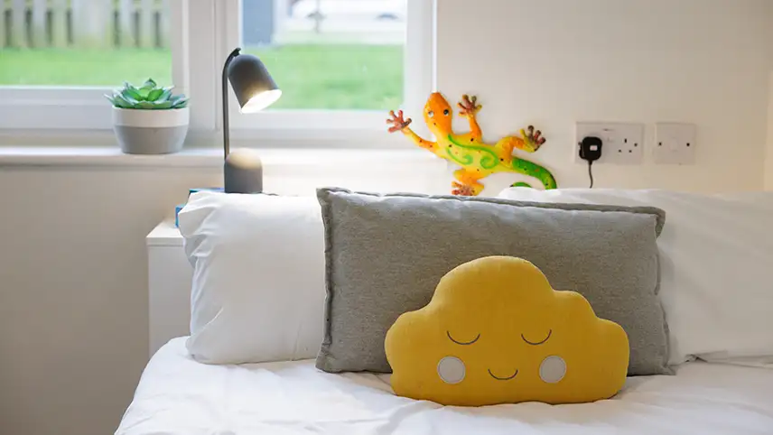 Pillows of sunshine on bed 