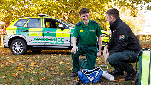 student and mentor with emergency vehicle 