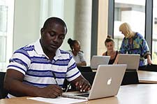 A student working on a laptop