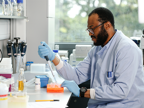 Student undertaking research in lab
