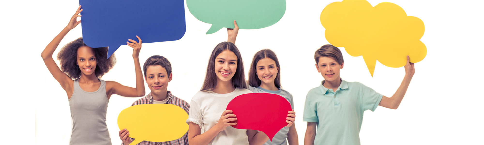 Male and female kids holding speech bubbles
