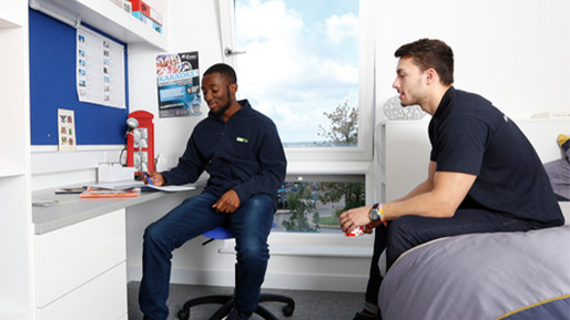 Male students in accommodation bedroom