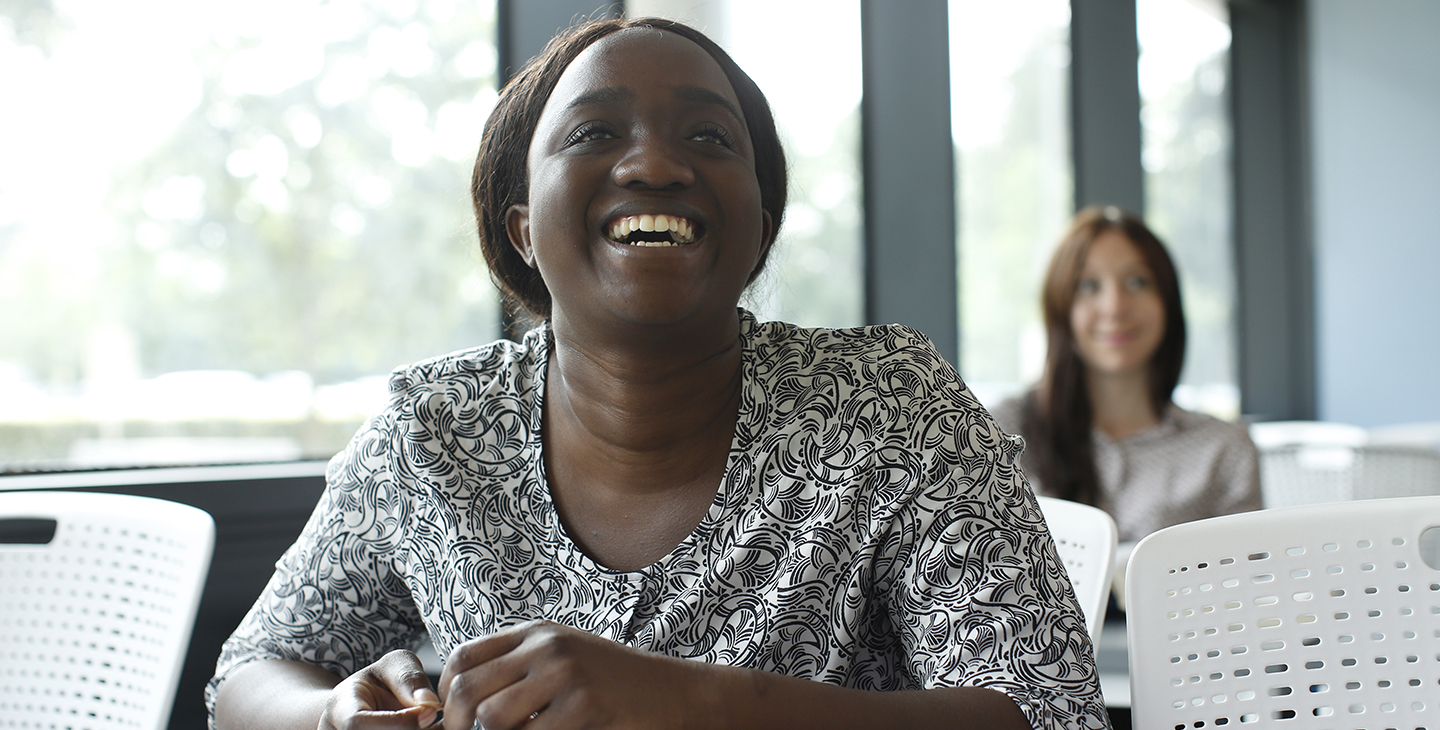 Female student laughing in class