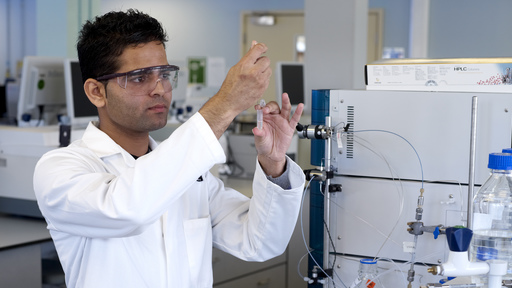 Male scientist conducting experiment