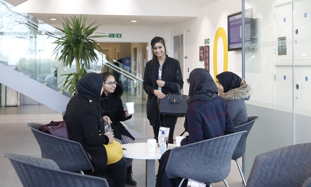 A group of female students relaxing in the lounge of the Science Building 