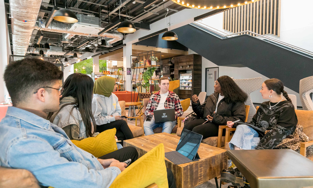 A group of students sitting in the Enterprise Hub