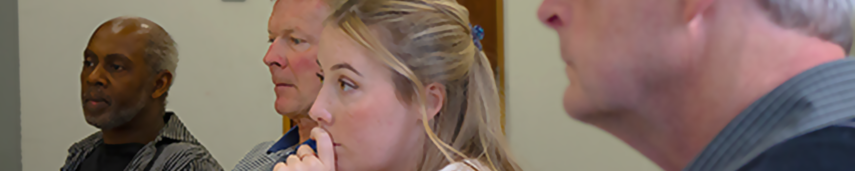Three people concentrating