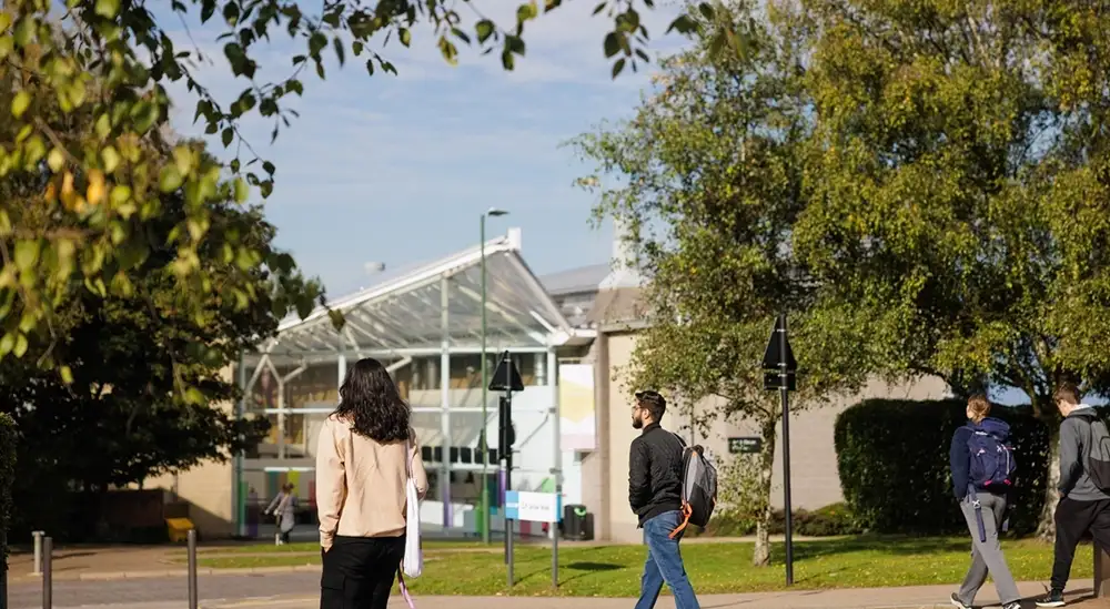 People walking with the art and design gallery in the distance