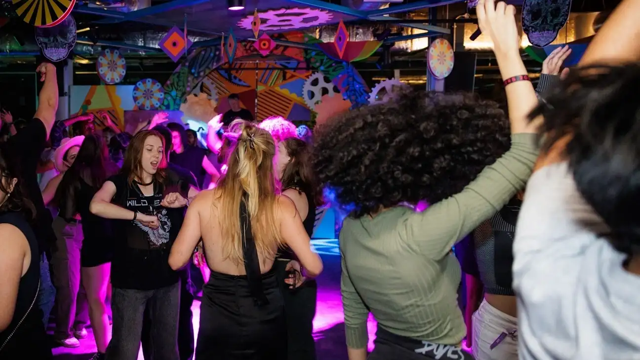 A group of students dancing in the nightclub