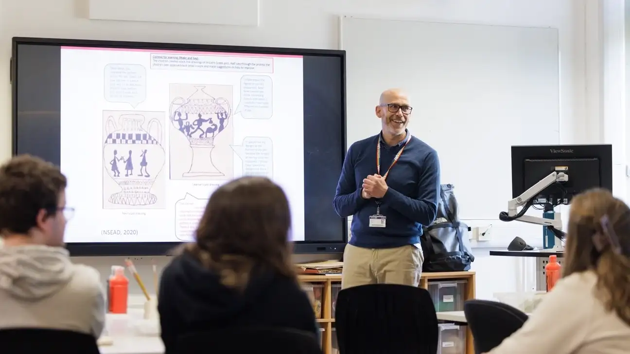 Teacher speaking to students 